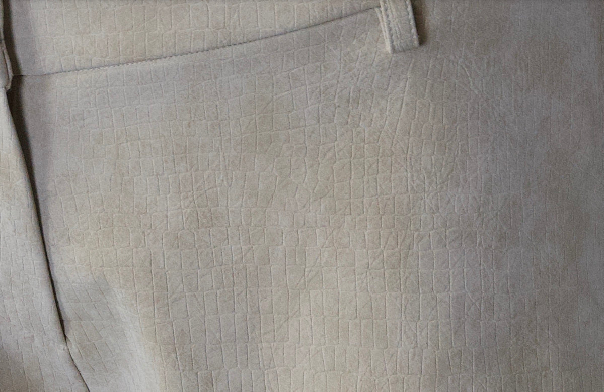 Close-up of the beige suede-effect crocodile texture on 3SPIRIT The Micro Shorts