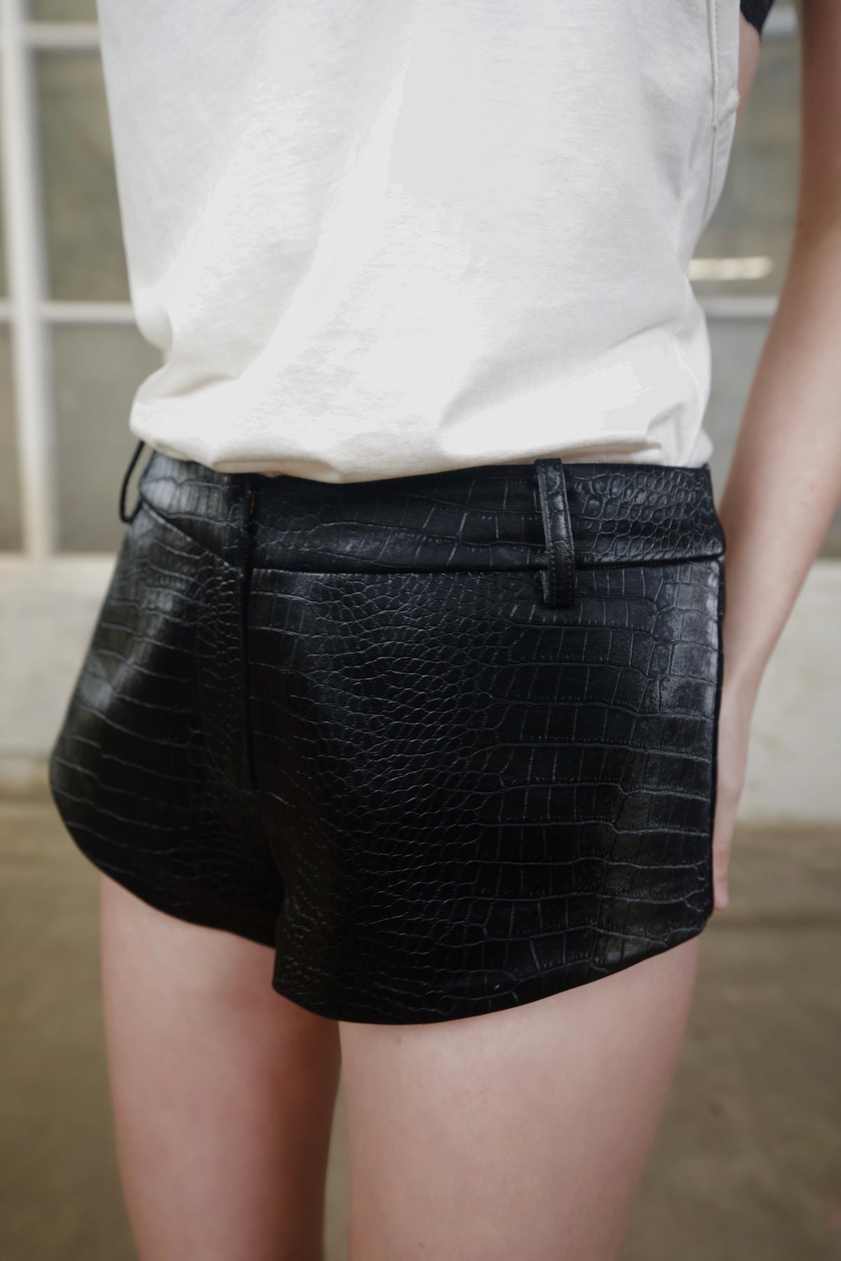Close-up of the black crocodile-effect faux leather texture on 3SPIRIT The Micro Shorts